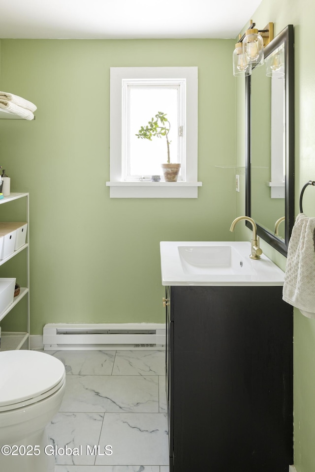 12 Mill St, Chatham, NY 12037 - half bathroom featuring baseboard heating, vanity, and marble look tile flooring