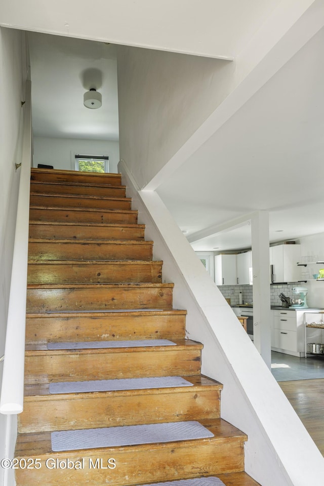 12 Mill St, Chatham, NY 12037 - stairway featuring wood finished floors
