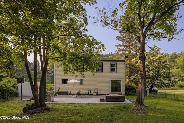 12 Mill St, Chatham, NY 12037 - rear view of house with a yard, outdoor lounge area, a patio, and a chimney