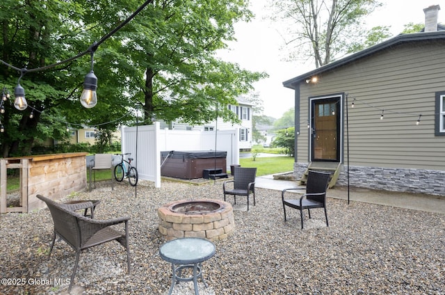 74 Feeder St, Hudson Falls, NY 12839 - view of patio / terrace featuring a hot tub and a fire pit