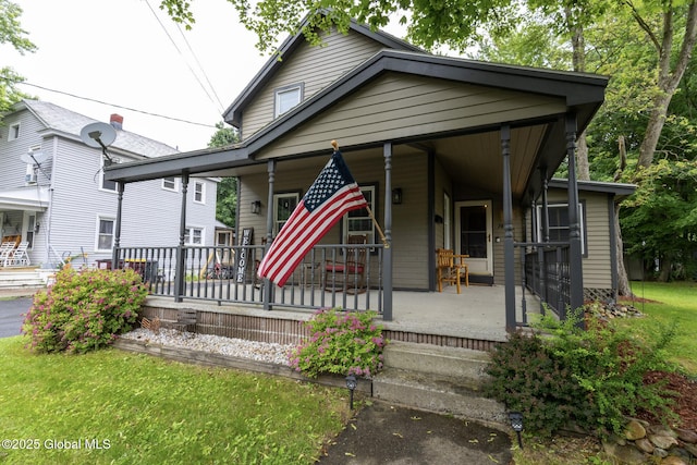 74 Feeder St, Hudson Falls, NY 12839 - view of front of property featuring a porch