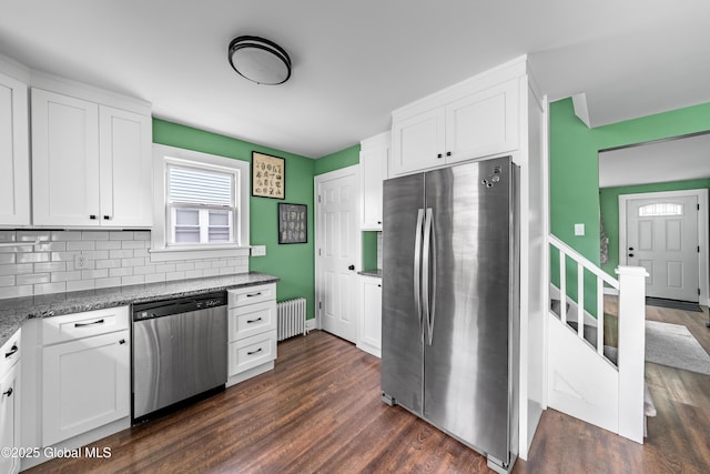 107 Frederick Ave, Colonie, NY 12205 - kitchen with stainless steel appliances, radiator, white cabinetry, and dark wood-type flooring