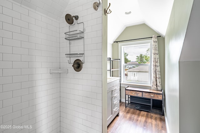 107 Frederick Ave, Colonie, NY 12205 - bathroom with a tile shower, wood finished floors, vaulted ceiling, and vanity