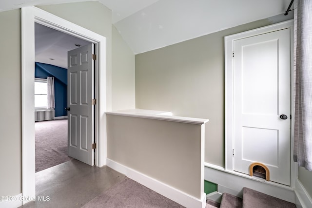 107 Frederick Ave, Colonie, NY 12205 - hallway with radiator heating unit, concrete floors, and carpet