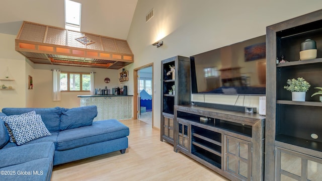 324 Elsmere Ave, Bethlehem, NY 12054 - living area featuring light wood-style flooring and a high ceiling