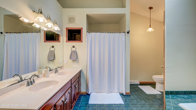 324 Elsmere Ave, Bethlehem, NY 12054 - bathroom featuring double vanity, tile patterned floors, baseboard heating, and a shower with curtain