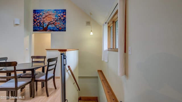 324 Elsmere Ave, Bethlehem, NY 12054 - dining space with vaulted ceiling and light wood-style flooring