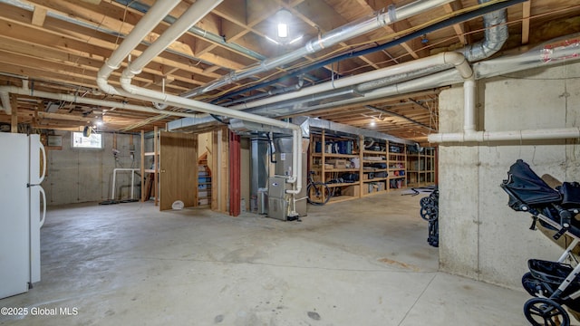 324 Elsmere Ave, Bethlehem, NY 12054 - below grade area featuring freestanding refrigerator and heating unit