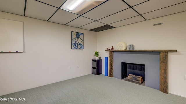 324 Elsmere Ave, Bethlehem, NY 12054 - living area with carpet, a fireplace, and a paneled ceiling