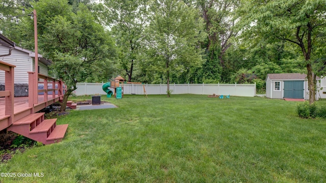 324 Elsmere Ave, Bethlehem, NY 12054 - fenced backyard with a playground, a deck, and a shed