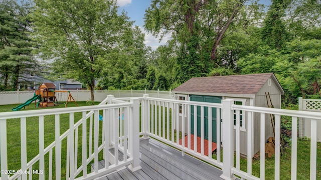 324 Elsmere Ave, Bethlehem, NY 12054 - wooden terrace with a fenced backyard, a storage unit, and a playground