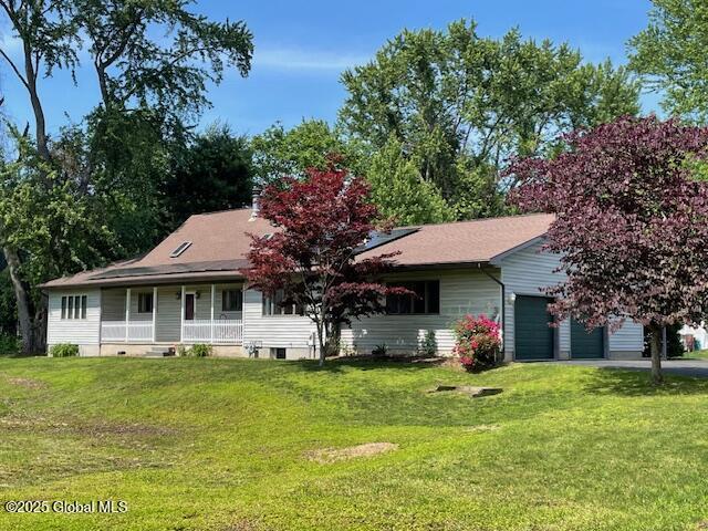 324 Elsmere Ave, Bethlehem, NY 12054 - view of front of property with a porch, a front lawn, and a garage