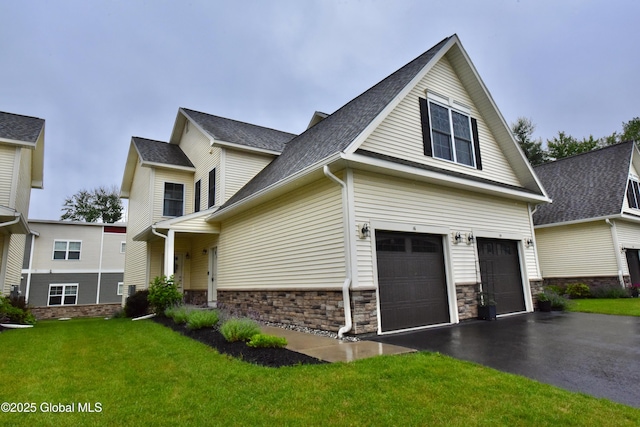 16 Anthony Pl, Ballston, NY 12020 - view of front facade featuring asphalt driveway, a garage, a front yard, roof with shingles, and stone siding