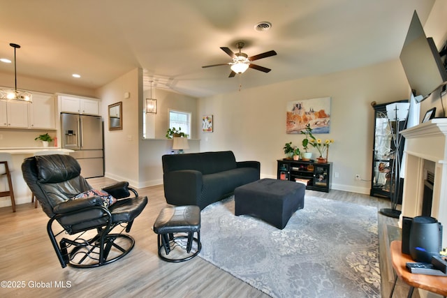 16 Anthony Pl, Ballston, NY 12020 - living area with a ceiling fan, light wood-style flooring, recessed lighting, and a fireplace