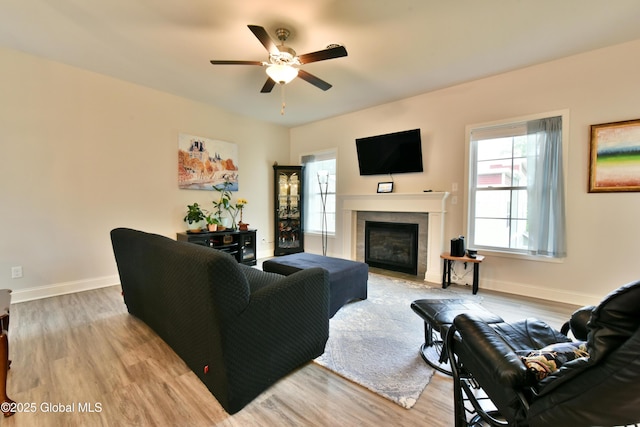 16 Anthony Pl, Ballston, NY 12020 - living room featuring a ceiling fan, light wood-type flooring, and a tiled fireplace