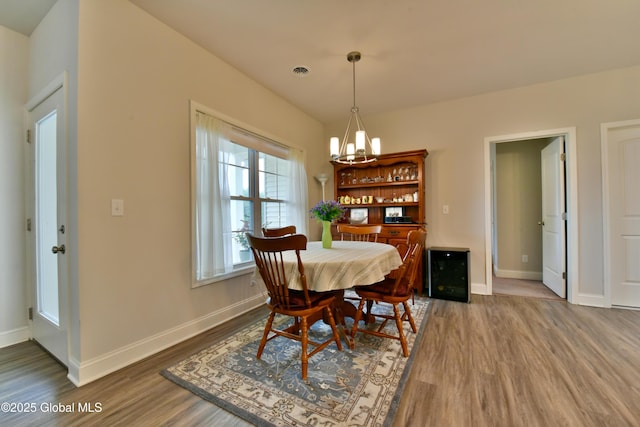 16 Anthony Pl, Ballston, NY 12020 - dining area with wood finished floors and a chandelier