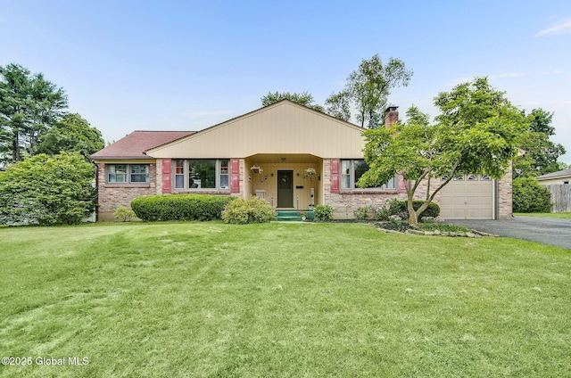 17 Malpass Rd, Guilderland, NY 12203 - view of front of property with driveway, a front yard, a chimney, and brick siding