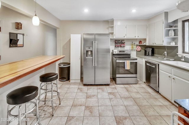 17 Malpass Rd, Guilderland, NY 12203 - kitchen with stainless steel appliances, open shelves, white cabinetry, light countertops, and recessed lighting