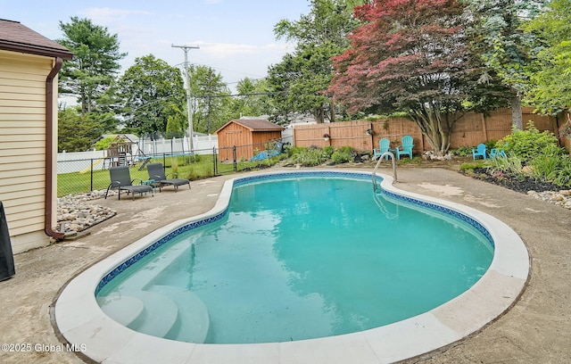 17 Malpass Rd, Guilderland, NY 12203 - view of swimming pool with a patio area, a fenced backyard, and a storage shed