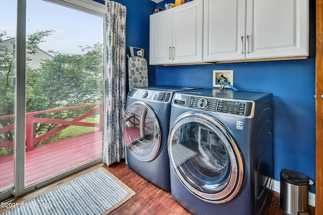 17 Malpass Rd, Guilderland, NY 12203 - washroom with cabinet space, washing machine and dryer, wood finished floors, and plenty of natural light