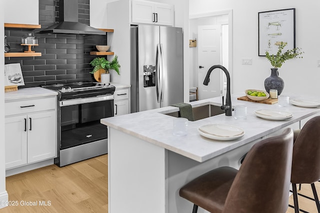 19 Forest Rd, Queensbury, NY 12845 - kitchen with open shelves, appliances with stainless steel finishes, wall chimney exhaust hood, tasteful backsplash, and a kitchen breakfast bar