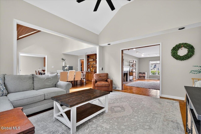 1 Fox Run, Colonie, NY 12110 - living area featuring lofted ceiling, wood finished floors, and a ceiling fan