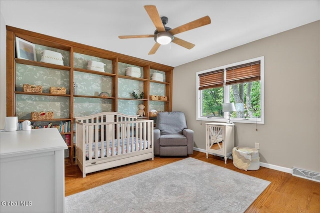 1 Fox Run, Colonie, NY 12110 - bedroom with a nursery area, wood finished floors, and ceiling fan