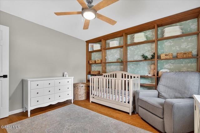 1 Fox Run, Colonie, NY 12110 - bedroom featuring wood finished floors, a crib, and a ceiling fan