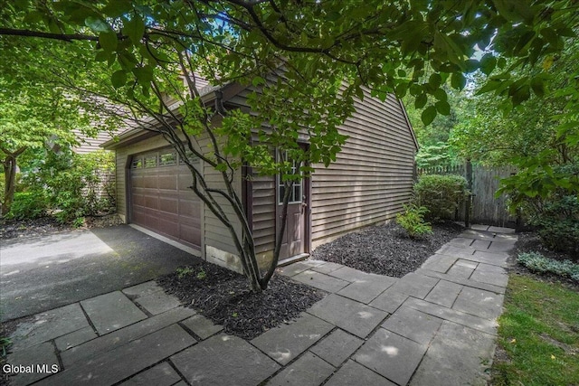 1 Fox Run, Colonie, NY 12110 - view of side of home featuring a garage and asphalt driveway