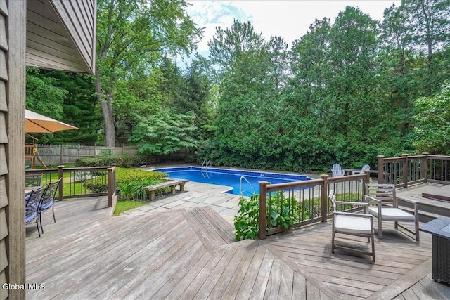 1 Fox Run, Colonie, NY 12110 - view of swimming pool featuring a fenced backyard, a deck, and view of wooded area