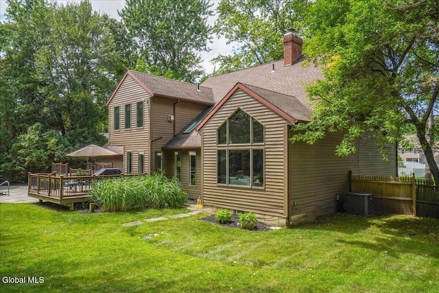 1 Fox Run, Colonie, NY 12110 - rear view of house featuring a wooden deck, a chimney, and roof with shingles