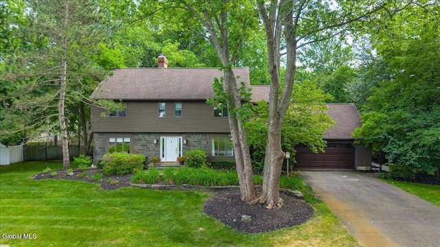 1 Fox Run, Colonie, NY 12110 - colonial-style house featuring a chimney, driveway, stone siding, a garage, and a shingled roof