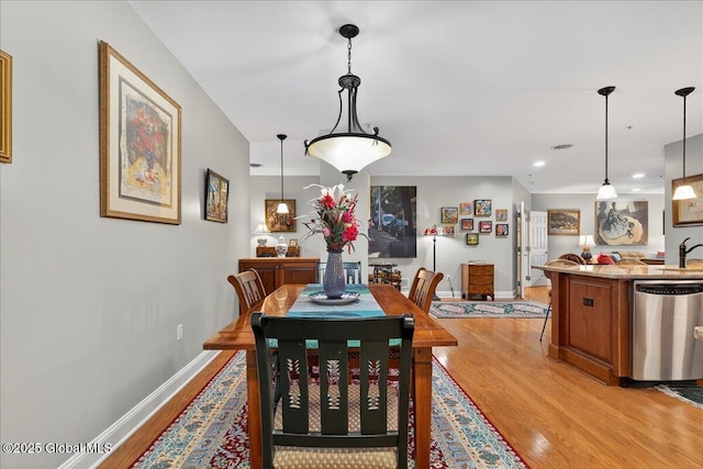 70 Railroad Pl Unit 207, Saratoga Springs, NY 12866 - dining area with light wood finished floors and baseboards