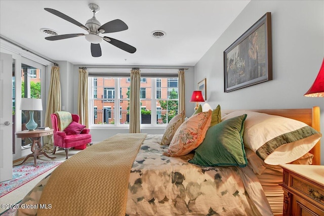 70 Railroad Pl Unit 207, Saratoga Springs, NY 12866 - bedroom with multiple windows and ceiling fan