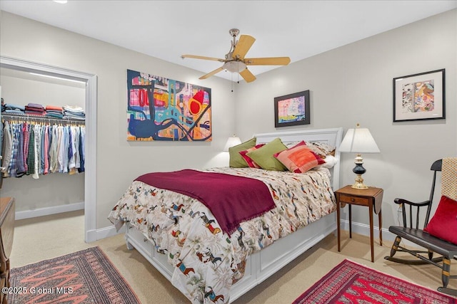 70 Railroad Pl Unit 207, Saratoga Springs, NY 12866 - bedroom with carpet floors, a walk in closet, a closet, and a ceiling fan