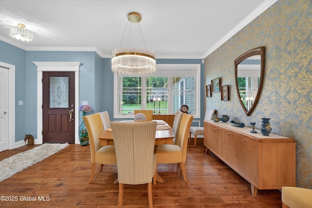 6 Corinne Ct, Saratoga, NY 12866 - dining room with wood finished floors, a chandelier, crown molding, and wallpapered walls
