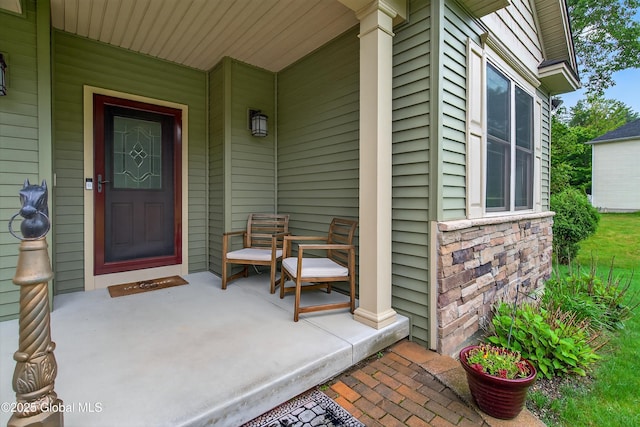 6 Corinne Ct, Saratoga, NY 12866 - view of exterior entry featuring a porch and stone siding