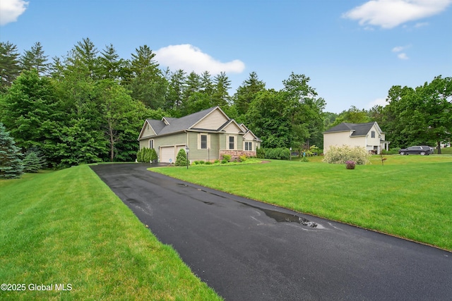 6 Corinne Ct, Saratoga, NY 12866 - view of front of home featuring a garage, asphalt driveway, and a front yard