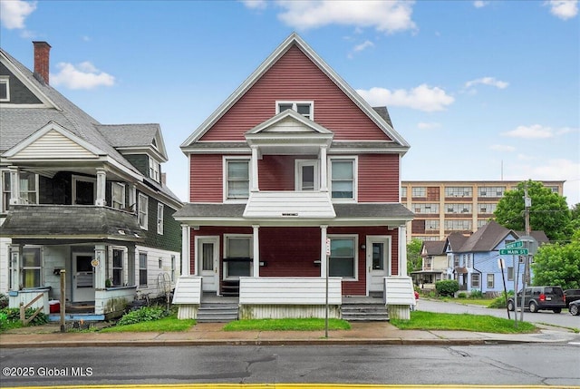 329 E Main St, Amsterdam, NY 12010 - view of front facade with a porch