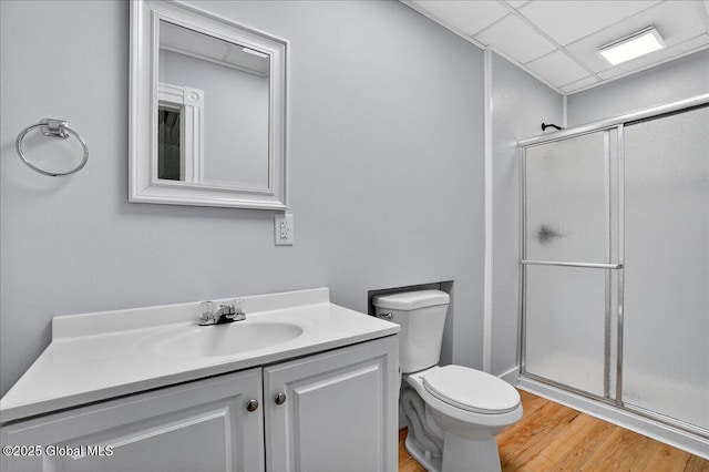 329 E Main St, Amsterdam, NY 12010 - bathroom featuring a stall shower, vanity, and wood finished floors