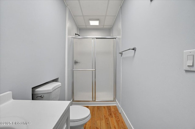 329 E Main St, Amsterdam, NY 12010 - full bathroom with a shower with shower door, wood finished floors, vanity, and a drop ceiling