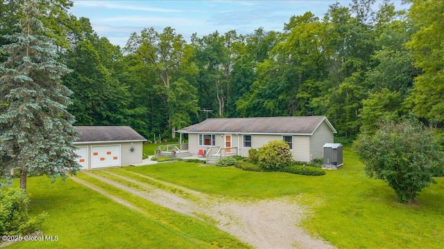 585 Logtown Rd, Glen, NY 12072 - view of front of property with an outdoor structure, driveway, a front yard, a wooded view, and a garage