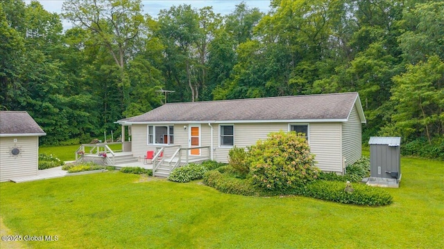 585 Logtown Rd, Glen, NY 12072 - view of front facade with a front yard, a wooden deck, and a wooded view