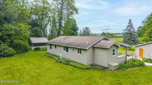 585 Logtown Rd, Glen, NY 12072 - rear view of house featuring a lawn and roof with shingles