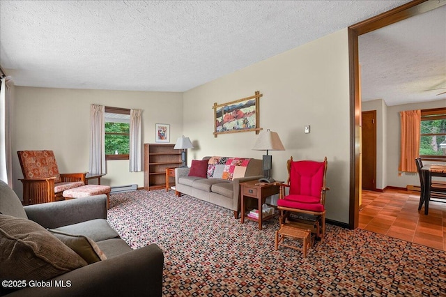 585 Logtown Rd, Glen, NY 12072 - living room featuring plenty of natural light, a textured ceiling, and a baseboard radiator