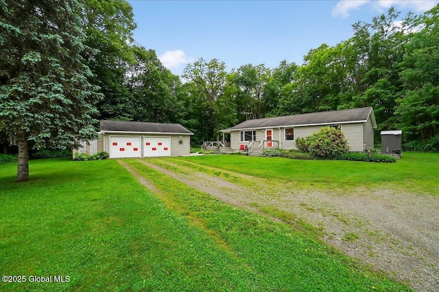 585 Logtown Rd, Glen, NY 12072 - view of front of house featuring driveway, an outbuilding, a detached garage, and a front yard