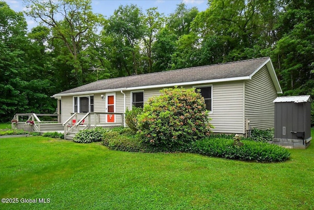 585 Logtown Rd, Glen, NY 12072 - view of front facade featuring a front yard, a wooden deck, and a shed
