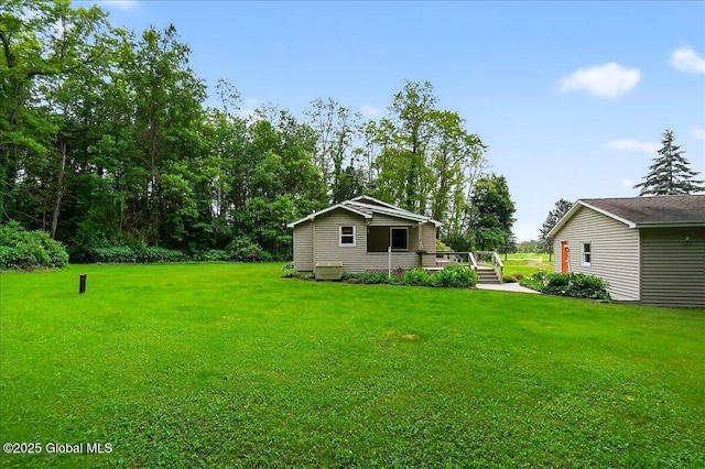 585 Logtown Rd, Glen, NY 12072 - view of green lawn with a deck
