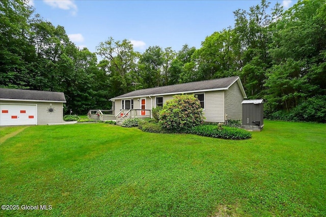 585 Logtown Rd, Glen, NY 12072 - view of front of home featuring an outbuilding, a front yard, a garage, and view of scattered trees