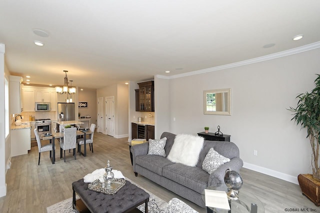 1E Brison St, North Greenbush, NY 12180 - living area with recessed lighting, light wood-style flooring, crown molding, and a chandelier